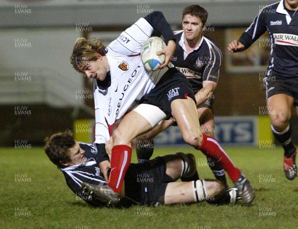 160104Neath Swansea Ospreys v Toulouse  Ospreys James Bater hauls down Cedric Heymans  