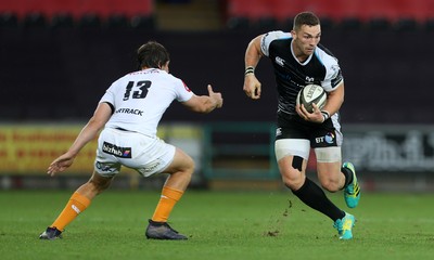 080918 - Ospreys v Toyota Cheetahs - Guinness PRO14 - George North of Ospreys is tackled by Bernhard Janse Van Rensburg of Cheetahs