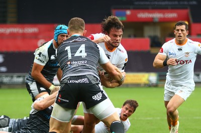 080918 - Ospreys v Edinburgh - GuinnessPro14 - Nico Lee of Cheetahs is tackled by George North (14) and Aled Davies of Ospreys