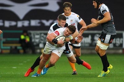 080918 - Ospreys v Edinburgh - GuinnessPro14 - Jasper Wiese of Cheetahs is tackled by Scott Williams of Ospreys