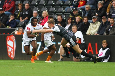 080918 - Ospreys v Edinburgh - GuinnessPro14 - William Small-Smith of Cheetahs is tackled by Tom Williams of Ospreys