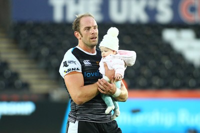 080918 - Ospreys v Edinburgh - GuinnessPro14 - Alun Wyn Jones leaves the field with his daughter at the end of the game