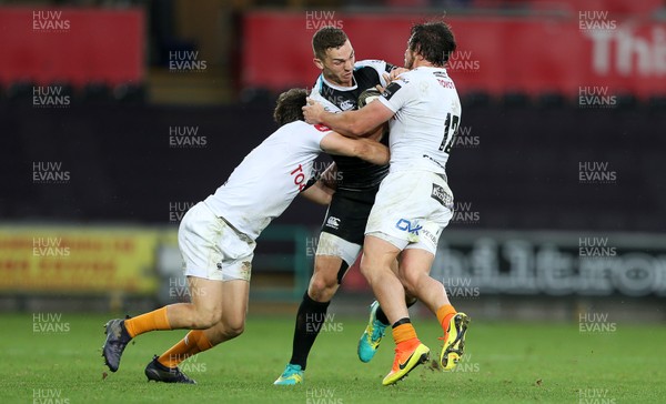 080918 - Ospreys v Toyota Cheetahs - Guinness PRO14 - George North of Ospreys is tackled by Bernhard Janse Van Rensburg and Nico Lee of Cheetahs