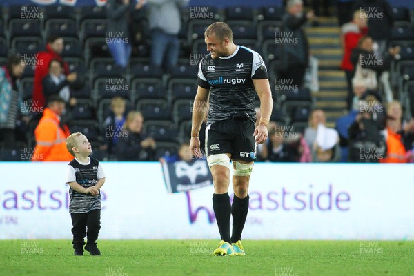 080918 - Ospreys v Edinburgh - GuinnessPro14 - James King of Osprey and son Archie spend some downtime after the final whistle
