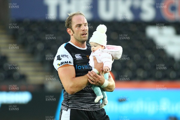 080918 - Ospreys v Edinburgh - GuinnessPro14 - Alun Wyn Jones leaves the field with his daughter at the end of the game