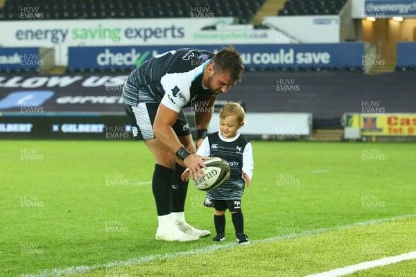 080918 - Ospreys v Edinburgh - GuinnessPro14 - Scott Baldwin of Ospreys and son Sonnie Blake spend some downtime after the final whistle