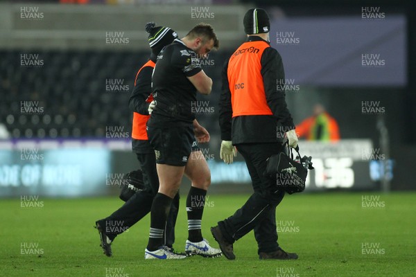 240218 - Ospreys v Toyota Cheetahs - GuinnessPro14 - Sam Parry of Ospreys leaves the field with an injury 