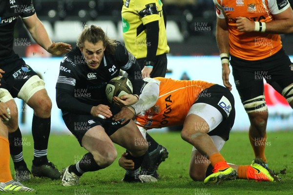 240218 - Ospreys v Toyota Cheetahs - GuinnessPro14 - Jeff Hassler of Ospreys is tackled by Nico Lee of Cheetahs 