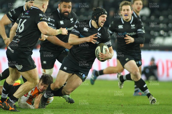 240218 - Ospreys v Toyota Cheetahs - GuinnessPro14 - Dan Evans of Ospreys is tackled by Nico Lee of Cheetahs