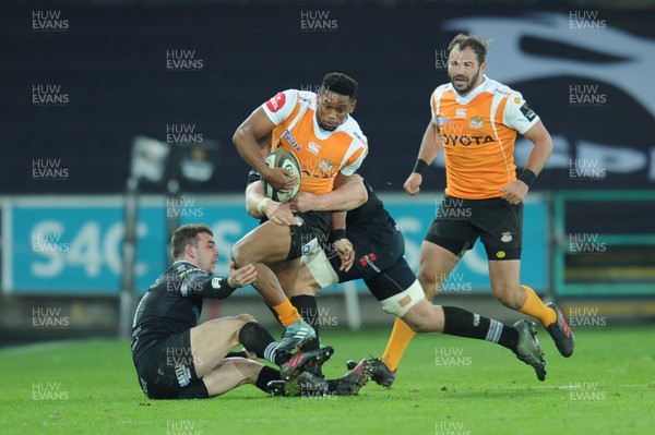 240218 - Ospreys v Toyota Cheetahs - Guinness PRO14 -  Craig Barry of Toyota Cheetahs is tackled by Olly Cracknell of Ospreys