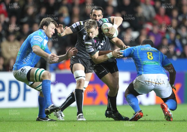 121012 Ospreys v TrevisoOspreys Dan Biggar is tackled by Treviso's Manoa Vosawai