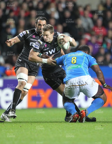 121012 Ospreys v TrevisoOspreys Dan Biggar is tackled by Treviso's Manoa Vosawai