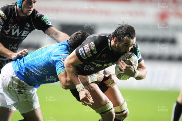 121012 Ospreys v TrevisoOspreys' Jonathan Thomas is tackled by Treviso's Robert Barbieri