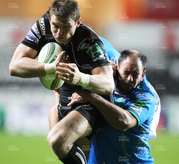 121012 Ospreys v TrevisoOspreys' Dan Biggar is tackled by Treviso's Tommaso Benvenuti