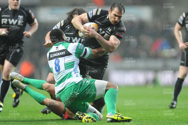 130413 - Ospreys v Treviso - RaboDirect PRO12 -Joe Bearman of Ospreys is tackled by Manoa Vosawai of Benetton Treviso 