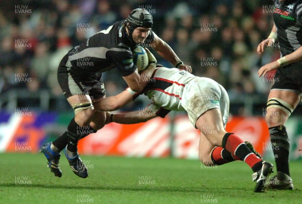 07.12.07 - Ospreys v Ulster - Heineken Cup - Ospreys' Marty Holah is tackled by Ulster's Rory Best 