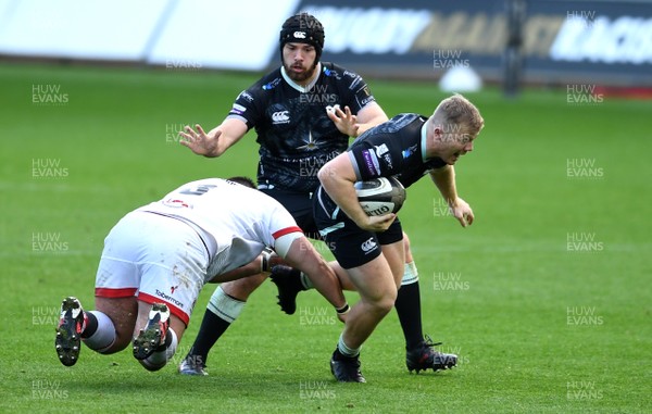 101020 - Ospreys v Ulster - Guinness PRO14 - Keiran Williams of Ospreys is tackled by Marty Moore of Ulster
