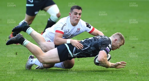 101020 - Ospreys v Ulster - Guinness PRO14 - Keiran Williams of Ospreys is tackled by James Hume of Ulster