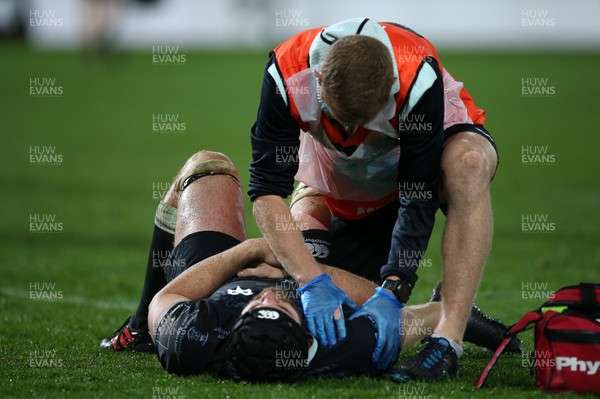 101020 - Ospreys v Ulster - Guinness PRO14 - Morgan Morris of Ospreys is seen to by medical staff