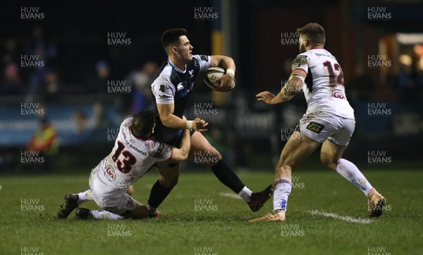 150219 - Ospreys v Ulster, Guinness PRO14 -  Tiaan Thomas-Wheeler of Ospreys is tackled by Darren Cave of Ulster and Stuart McCloskey of Ulster