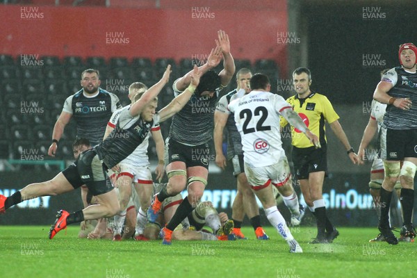 150220 - Ospreys v Ulster - GuinnessPro14 - Bill Johnston of Ulster has his drop kick charged down by Aled Davies(L) and Adam Beard of Ospreys