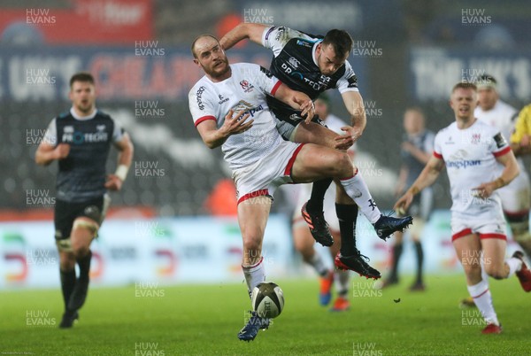 150220 - Ospreys v Ulster Rugby, Guinness PRO14 - Matt Faddes of Ulster and Cai Evans of Ospreys compete for the ball