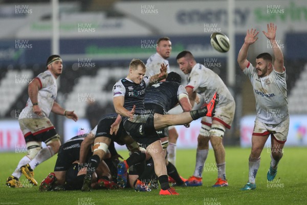 150220 - Ospreys v Ulster Rugby, Guinness PRO14 - Aled Davies of Ospreys kicks ahead as Adam McBurney of Ulster closes in