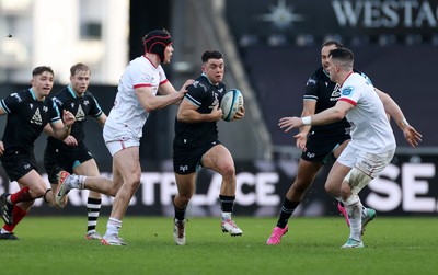 180224 - Ospreys v Ulster - United Rugby Championship - Reuben Morgan-Williams of Ospreys is tackled by Jude Postlewaithe of Ulster 