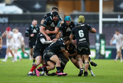 180224 - Ospreys v Ulster - United Rugby Championship - Dan Edwards of Ospreys is piled on in the celebration after kicking a drop goal in the last seconds of the game to win the match