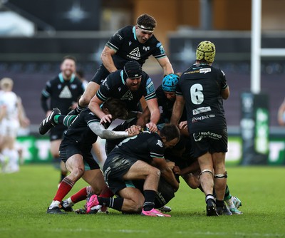 180224 - Ospreys v Ulster - United Rugby Championship - Dan Edwards of Ospreys is piled on in the celebration after kicking a drop goal in the last seconds of the game to win the match