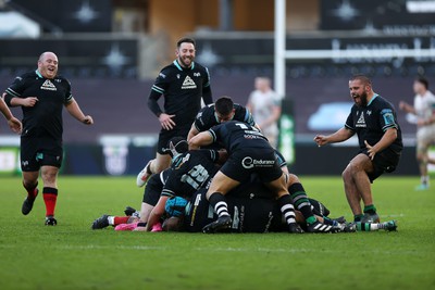 180224 - Ospreys v Ulster - United Rugby Championship - Dan Edwards of Ospreys is piled on in the celebration after kicking a drop goal in the last seconds of the game to win the match