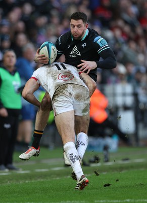 180224 - Ospreys v Ulster, United Rugby Championship - Alex Cuthbert of Ospreys is tackled by Jacob Stockdale of Ulster