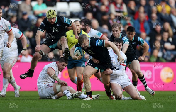 180224 - Ospreys v Ulster - United Rugby Championship - Keiran Williams of Ospreys is tackled by Jacob Stockdale of Ulster 