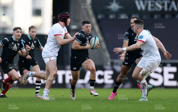 180224 - Ospreys v Ulster - United Rugby Championship - Reuben Morgan-Williams of Ospreys is tackled by Jude Postlewaithe of Ulster 