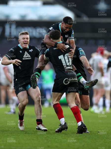 180224 - Ospreys v Ulster - United Rugby Championship - Dan Edwards of Ospreys celebrates with team mates after kicking a drop goal in the last seconds of the game to win the match