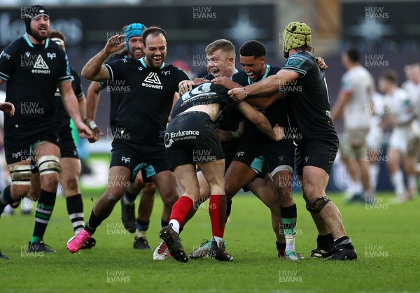 180224 - Ospreys v Ulster - United Rugby Championship - Dan Edwards of Ospreys celebrates with team mates after kicking a drop goal in the last seconds of the game to win the match