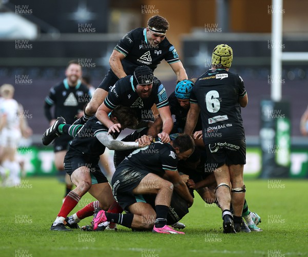 180224 - Ospreys v Ulster - United Rugby Championship - Dan Edwards of Ospreys is piled on in the celebration after kicking a drop goal in the last seconds of the game to win the match