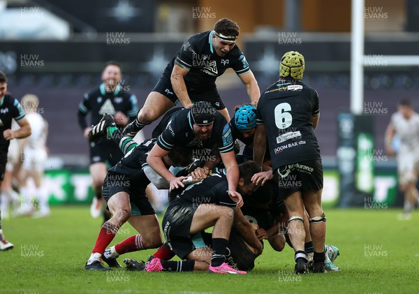 180224 - Ospreys v Ulster - United Rugby Championship - Dan Edwards of Ospreys is piled on in the celebration after kicking a drop goal in the last seconds of the game to win the match