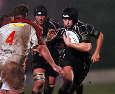 211005 - Ospreys v Ulster - Celtic League - Ospreys' Ryan Jones takes on Gary Longwell