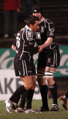 211005 - Ospreys v Ulster - Celtic League - Ospreys' Gavin Henson is congratulated on try by Brent Cockbain