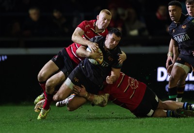 280226 - Ospreys v Ulster Rugby, United Rugby Championship - Owen Watkin of Ospreys is tackled