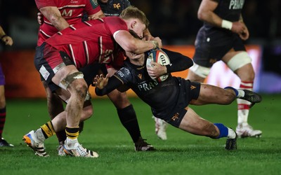 280226 - Ospreys v Ulster Rugby, United Rugby Championship - Jack Walsh of Ospreys is tackled by Bryn Ward of Ulster