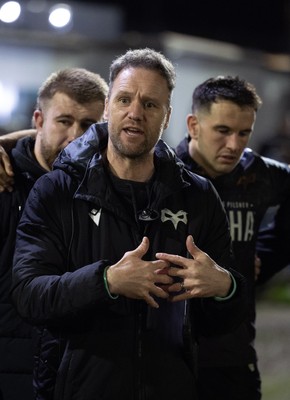 280226 - Ospreys v Ulster Rugby, United Rugby Championship - Ospreys head coach Mark Jones speaks to the team at the end of the match