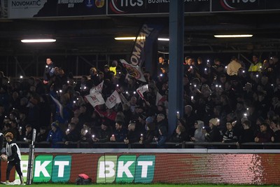 280226 - Ospreys v Ulster - United Rugby Championship - Fans shine their phone lights in protest in the 11th minute after the recent decision made regarding Ospreys by the WRU