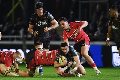 280226 - Ospreys v Ulster - United Rugby Championship - Owen Watkin of Ospreys is challenged by Bryn Ward of Ulster