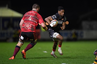 280226 - Ospreys v Ulster - United Rugby Championship - Dan Kasende of Ospreys is challenged by Iain Henderson of Ulster