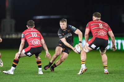 280226 - Ospreys v Ulster - United Rugby Championship - Keiran Williams of Ospreys is challenged by Jack Murphy of Ulster