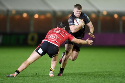 280226 - Ospreys v Ulster - United Rugby Championship - Keiran Williams of Ospreys is challenged by Jude Postlethwaite of Ulster