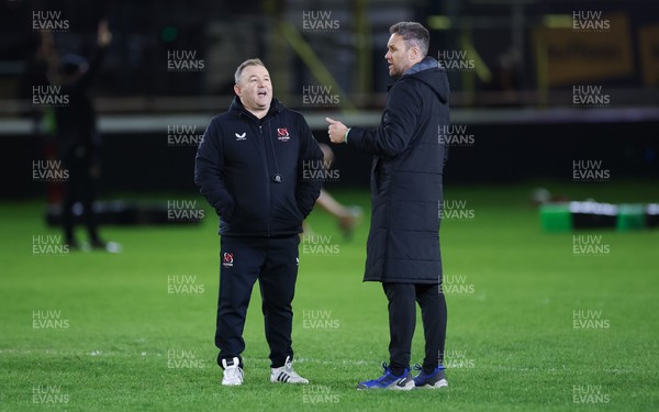 280226 - Ospreys v Ulster Rugby, United Rugby Championship - Ulster head coach Richie Murphy and Ospreys head coach Mark Jones chat ahead of the match