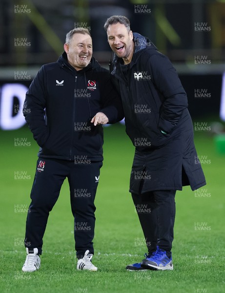 280226 - Ospreys v Ulster Rugby, United Rugby Championship - Ulster head coach Richie Murphy and Ospreys head coach Mark Jones chat ahead of the match